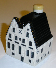 AMSTELVEEN, October 9, 2006 â€“ KLM Royal Dutch Airlines celebrated its 87th anniversary in true tradition on October 7, 2006, with the presentation of a new Delftware miniature. The Delftware miniatures are replicas of Dutch historical buildings. The Peperhuis (Pepper House) on the Wierdijk in Enkhuizen was selected as the 87th miniature. Mr. Rob van Hijfte,Vice President Cabin Inflight Management, officially presented the first copy of the new house to Mr. Erik Schilp, managing director of the Zuiderzee Museum.

The Peperhuis is the oldest building of the Zuiderzee Museum. The first stone was laid in 1925 at the behest of shipping merchant Pieter van Berensteyn, who lived and worked in the Peperhuis. In 1682, the Enkhuizen Chamber of the Dutch East India Company (Verenigde Oostindische Compagnie â€“ VOC) purchased the building for 2,600 guilders and began using it as a warehouse.

KLM has been presenting the Delftware miniatures to its World Business Class passengers on intercontinental flights since the 1950s. The collection has grown in sync with KLMâ€™s anniversary since 1994, with a new house being added each year. The Delftware miniatures have become highly prized collectors items in the Netherlands and abroad.

History of the house
The Peperhuis consists of two adjoining parts. The front of the building faces the Wierdijk and the other side the Oosterhaven. Van Berensteyn occupied the front section. The double stepped gable of the Peperhuis on the Wierdijk is impressive for several reasons. The central plaque shows an image of the herring harvest, accompanied by the old, economic adage â€œnothing ventured, nothing gained.â€ A striking feature in the buildingâ€™s faÃ§ade is the green door on the first floor. This was not the door to the warehouse, but led to the home of Pieter van Berensteyn. An extended stone staircase â€“ long since vanished â€“ provided access to the house. A monogram of the Enkhuizen Chamber of the VOC can be seen at the back of the building.

Like most VOC warehouses, the Peperhuis did not only serve as storage space. Colonial goods were also unpacked, weighed, sorted and prepared for twice-yearly auction. The Peperhuis has served numerous purposes after the VOC was disbanded in 1798. It has been used as a naval hospital and as a warehouse for cheese and seeds. It served the latter purpose until 1946, when the Royal Sluis & Groot Seed Growers and Traders Company donated the building to the Friends of the Zuiderzee Museum.